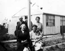 Family group at Porter's Field prefab