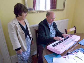 Rosemary and Ian playing the keyboard