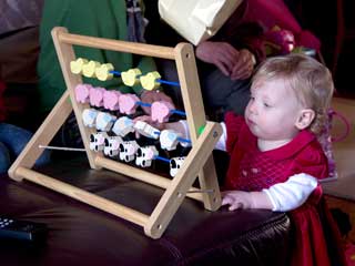 Freya plays with her new abacus