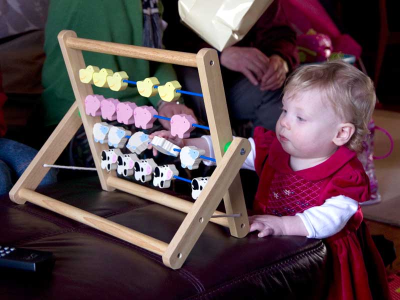 Freya with an abacus from Great Aunty Rosemary